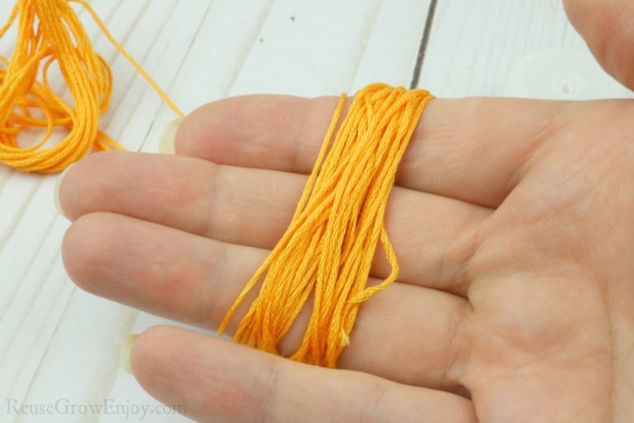 Wrap thread around hand