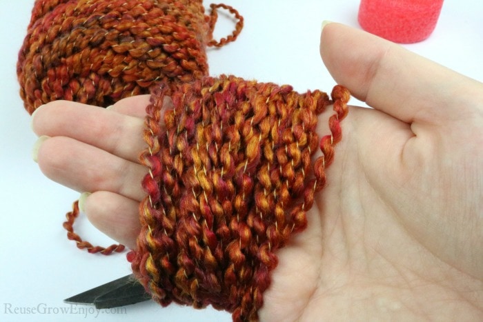 Wrap yarn around hand