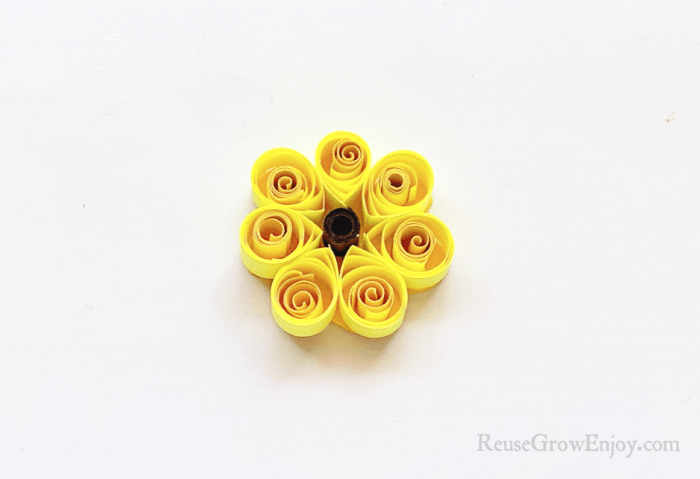 Yellow paper trimmed around around the petals