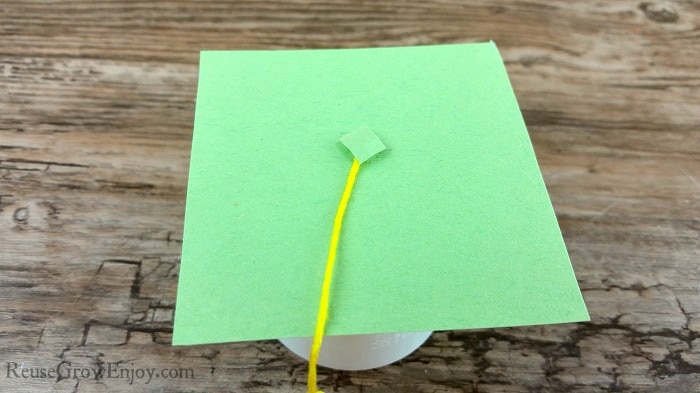 glue small paper to top